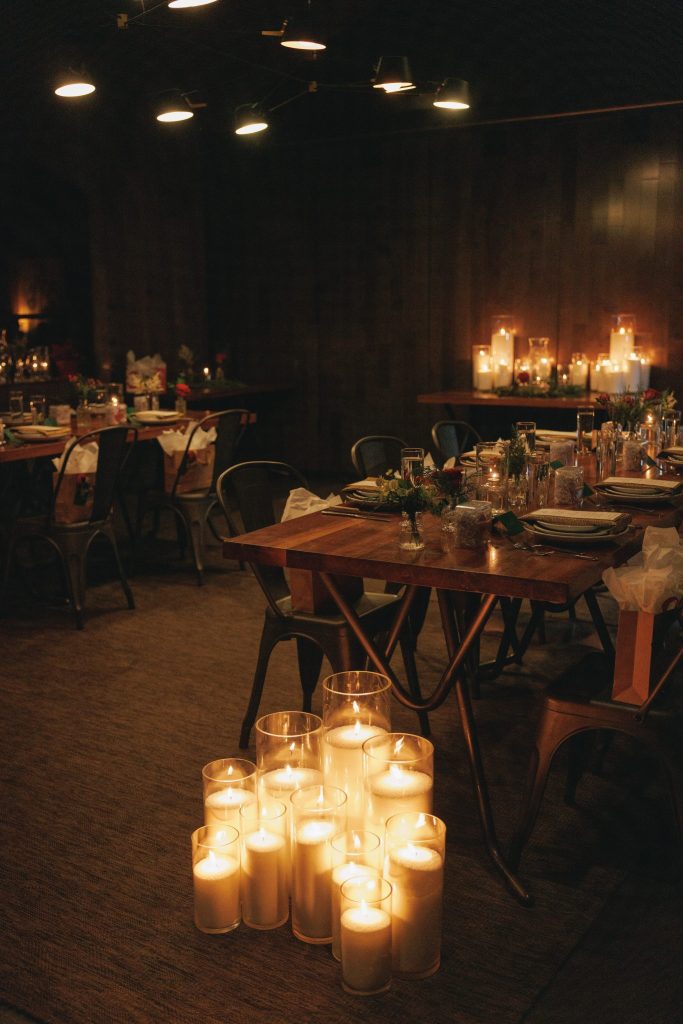 granulated wax sand candles glowing at Nashville wedding