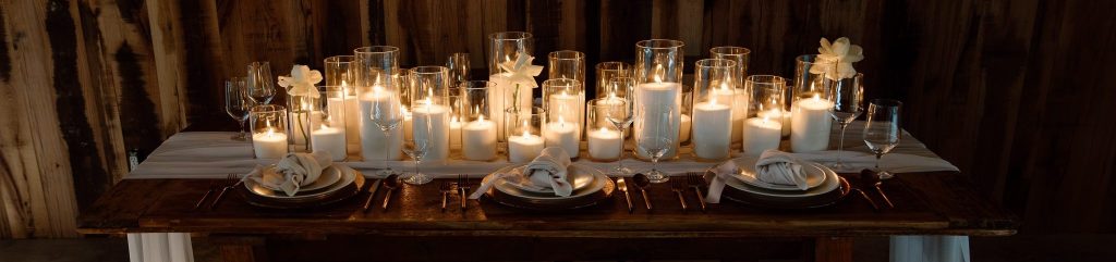 granulated wax sand candles glowing at Nashville wedding