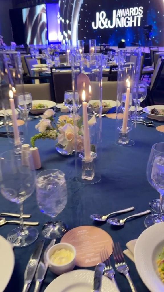 tall taper candles in gold holders for Nashville event